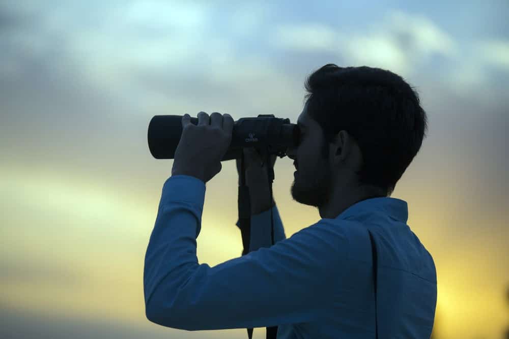 man with binoculars
